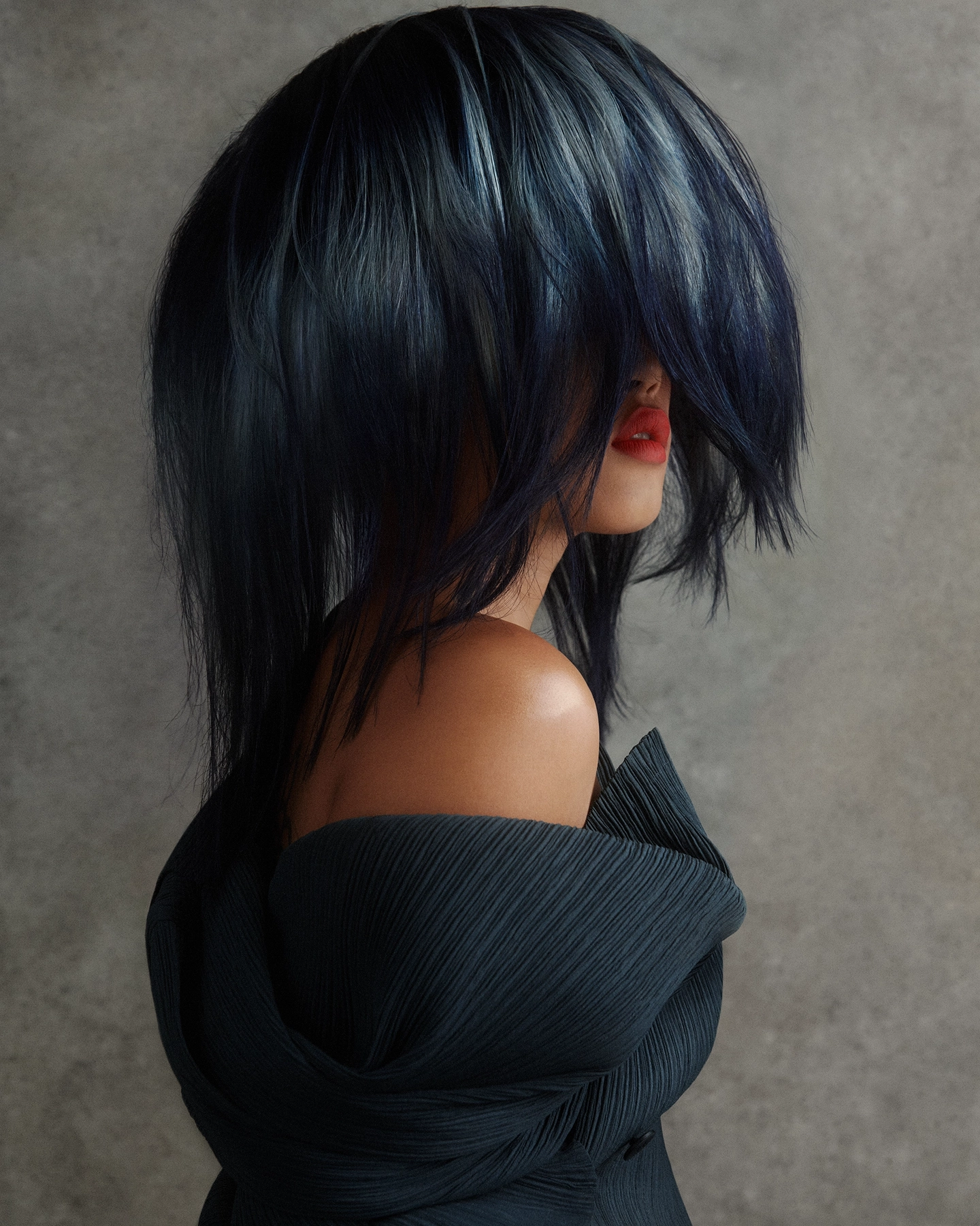 Elyse with voluminous dark blue hair obscuring face, red lip and pleated off-shoulder top for Vogue Philippines, makeup by Mary-Jane Gotidoc, hair by Michael Kent, styled by Carlos Mangubat