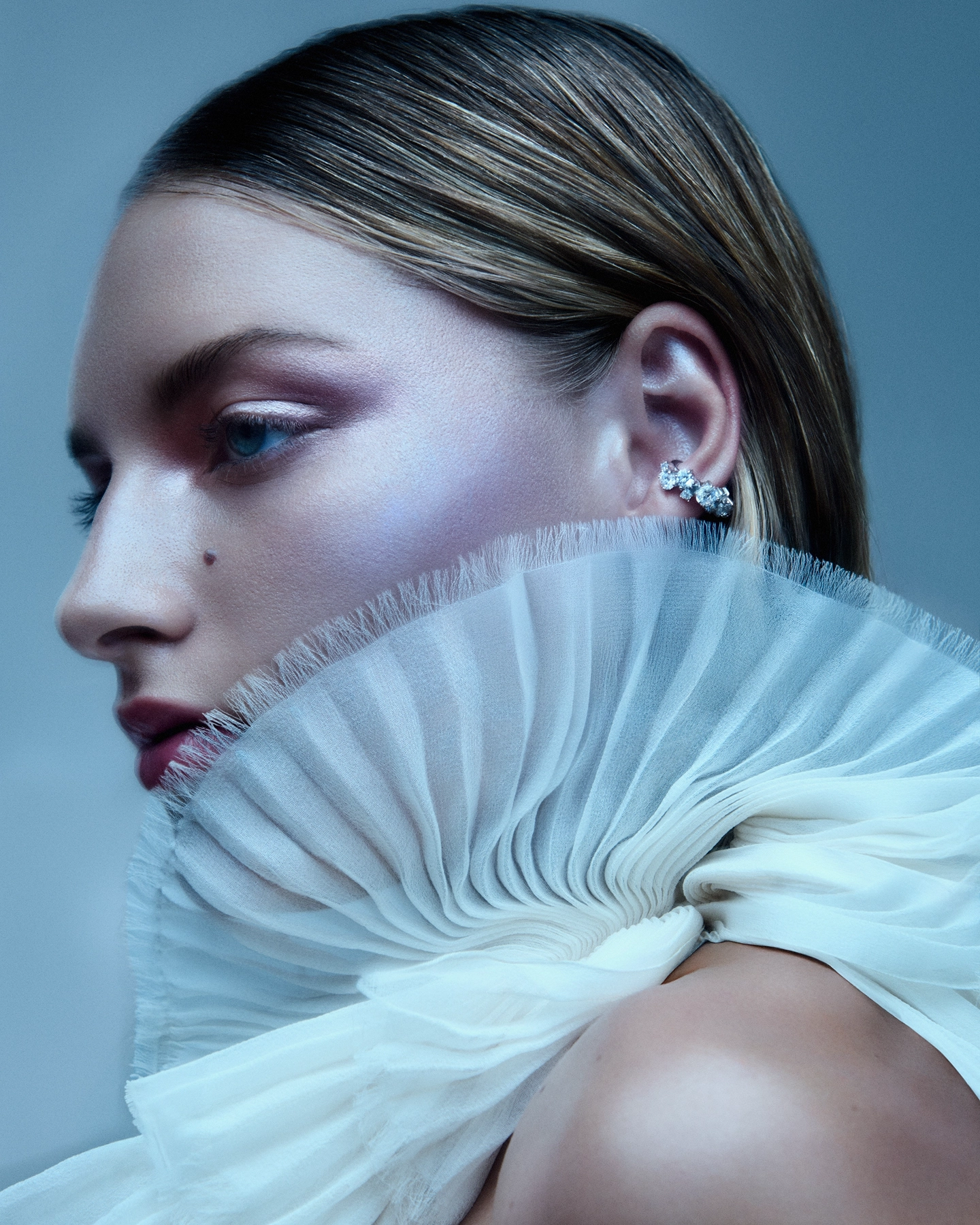 Profile with lavender eyeshadow, crystal ear stud and pleated ruffle collar for 5 Eleven Magazine Corals series, makeup by Karissa McLaren
