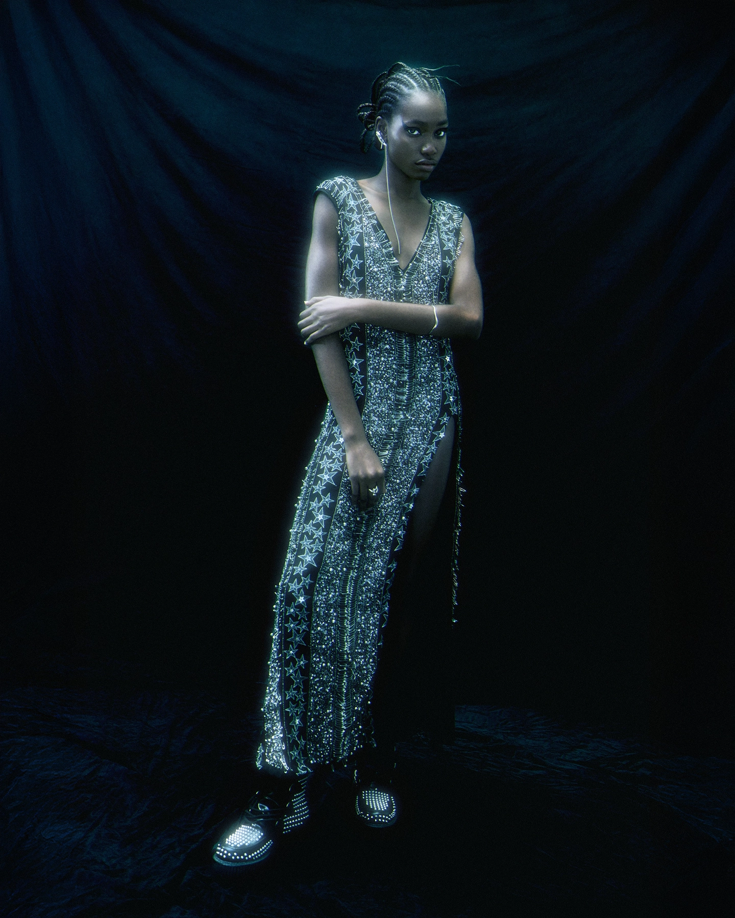 Gifty in embellished silver beaded jumpsuit against dark draped backdrop for Schon Magazine, styled by Carlos Mangubat, hair by Bjorn Krischker